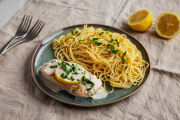 Homemade Creamy Lemon Chicken in a Pan, side view.