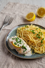 Homemade Creamy Lemon Chicken in a Pan, side view.