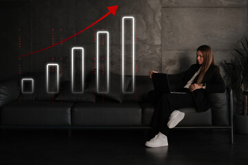 woman businessman freelancer working on the couch behind a laptop in the office