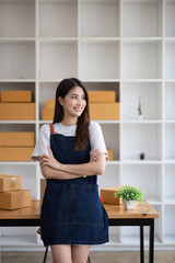 Starting Small business entrepreneur SME freelance, Portrait young woman working at home office, BOX, smartphone, laptop, online, marketing, packaging, delivery, b2b, SME, e-commerce concept..