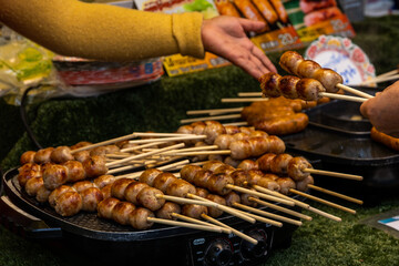 Night food market with seafood, fish, grilled meat, sausages and sweets in Krabi, Thailand, Southeast Asia, February, 2022