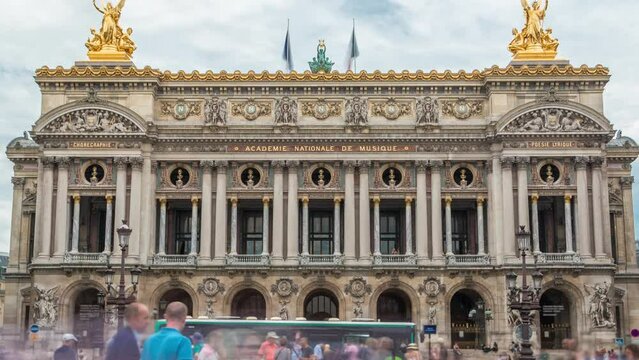 Palais or Opera Garnier The National Academy of Music front view timelapse in Paris, France. People walking around and traffic on the street. Metro entrance.