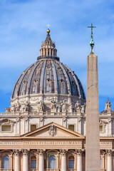 Fototapeta na wymiar St. Peter's basilica dome and Egyptian obelisk on St. Peter's square in Vatican