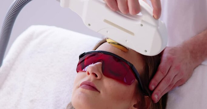 Beautician Giving Epilation Laser Treatment