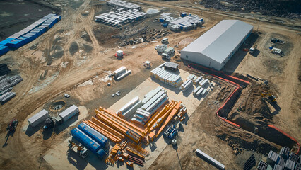 Aerial view of construction site. Outdoor warehouse of building materials
