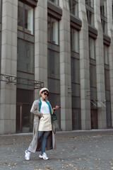 Brunette in a beret in the autumn city