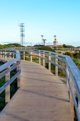 Wooden bridge to sightseeing place on Algarve coast outside Lagos, Portugal. Portuguese beaches and shores of the city of Lagos. 
