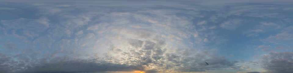 Panorama of a dark blue sunset sky with golden Cumulus clouds. Seamless hdr 360 panorama in spherical equiangular format. Full zenith for 3D visualization, sky replacement for aerial drone panoramas.