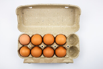 Chicken eggs in a package top view on a white isolated background.Eggs set. View from above.