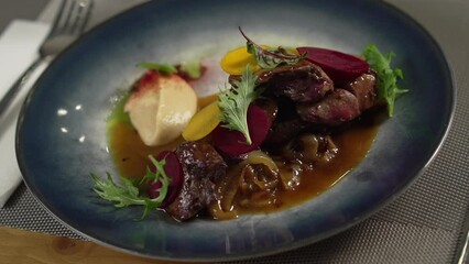 Fine dining meal with meat on the restaurant table