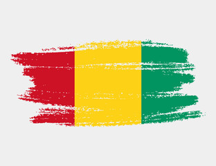 Artistic grunge brush flag of Guinea isolated on white background. Elegant texture of national country flag