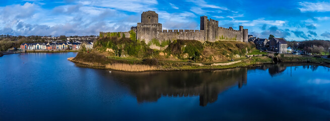 Fototapeta na wymiar An aerial view of the west side of the castle at Pembroke, Wales just before sunset