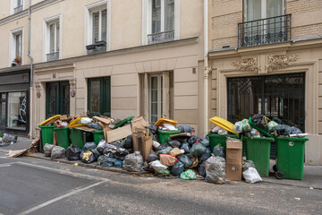 Paris, France - 03 28 2023: Garbage cans left on the public highway, following the garbage...
