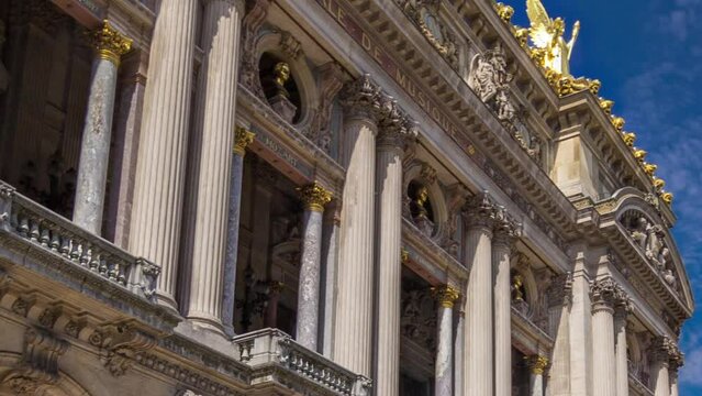 Palais or Opera Garnier The National Academy of Music facade timelapse hyperlapse in Paris, France. Stairs to the entrance. People walking around and traffic on the street.