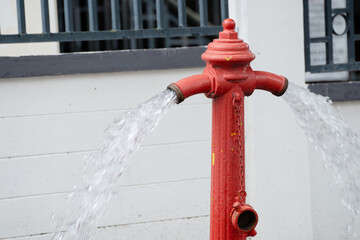 Fire hydrant being flushed by for maintenance. Fire hydrant leaking.