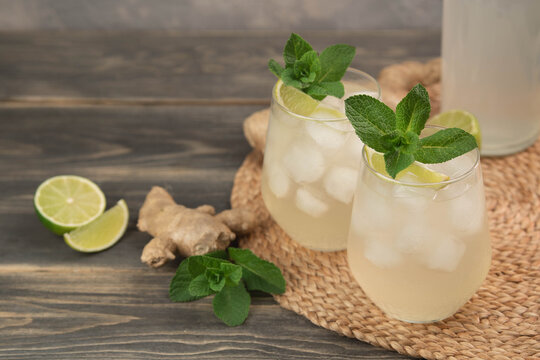 Fresh cocktail prepared with ginger beer, lime and ice. Beverage on the table. Image contains copy space for text. Fresh drink.