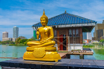 Golden buddha statues at Gangarama Seema Malakaya buddhist temple at Colombo, Sri Lanka