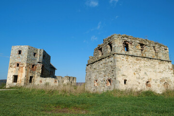 Ancient stone towers in Pniv Castle - medieval historical object, Ukraine