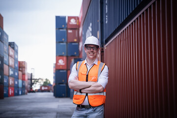 Portrait of Industrial Engineer or foreman Working in container yard.