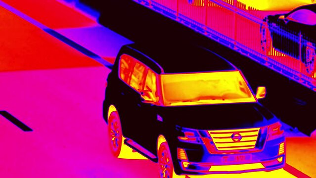 city traffic. Passenger car crossover or SUV moves along the city street. Illustration of thermal image. . Super slow motion 1000 fps.