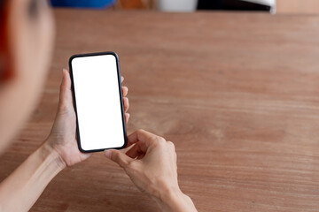 cell phone blank white screen mockup.hand holding texting using mobile on desk at office.background empty space for advertise.work people contact marketing business,technology