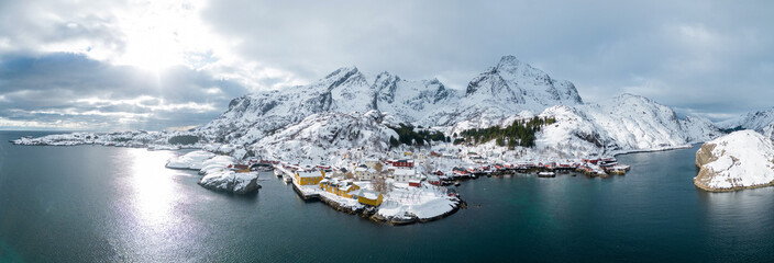 Aerial landscape photography. Sunny winter view of Nusfjord town, Norway, Europe. Bright morning scene of Lofoten Islands. Norwegian seascape. View from flying drone. Life over polar circle.