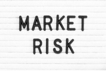Black color letter in word market risk on white felt board background