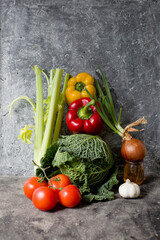 various vegetables over grey stone background