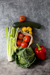 various vegetables over grey stone background