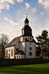 Fototapeta na wymiar German village Gundernhausen Daytime clouds church