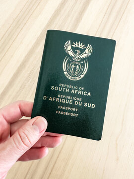 South African Passport Being Held In A Hand