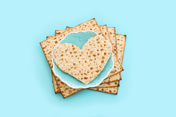 Pesah celebration concept (jewish Passover holiday) over pastel blue background