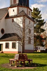 Fototapeta na wymiar German village Gundernhausen Daytime clouds church