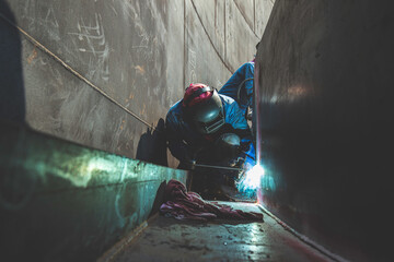 Welding male worker metal is part in machinery nozzle pipeline construction