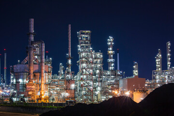 Night scene of oil refinery plant and tower column of Petrochemistry industry site construction