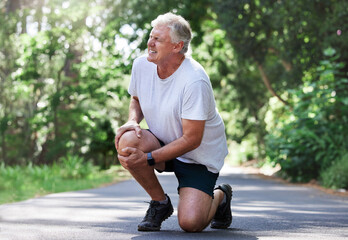 Running, injury and old man with knee pain on path in nature for outdoor fitness and workout...