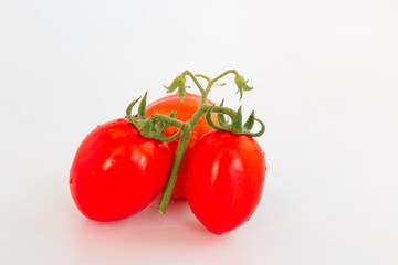 red ripe tomatoes on a white background