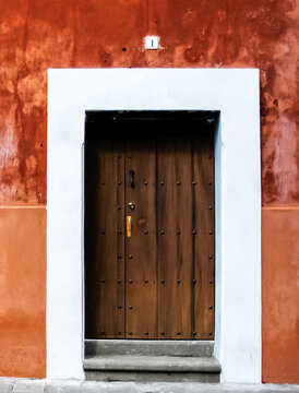 Wood Door on Orange Wall