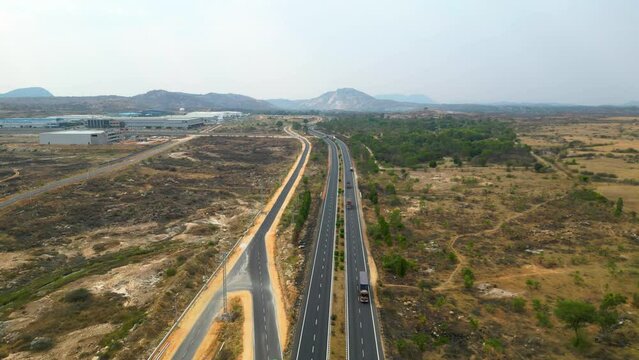 DRONE | 4k | 60 FPS 

Aerial view of a 4-lane highway in India.  
Shot from a drone, this is a 4-lane highway connecting the cities of Hyderabad and Bangalore. 