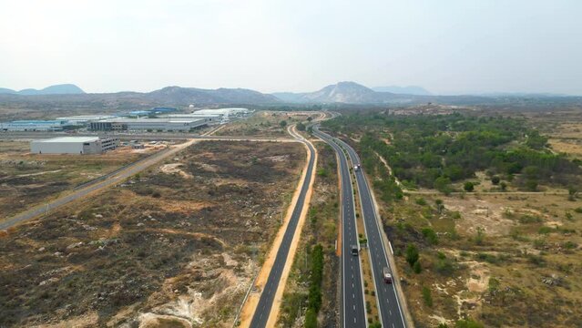 DRONE | 4k | 60 FPS 

Aerial view of a 4-lane highway in India.  
Shot from a drone, this is a 4-lane highway connecting the cities of Hyderabad and Bangalore. 