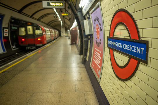 London- Mornington Crescent Underground logo on platform, Northern Line tube station