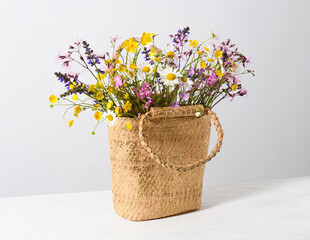 Straw bag with wildflowers