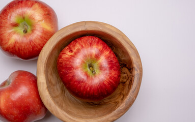 Red apples on the table close-up on a white background.