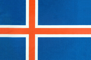 Fototapeta premium the national flag of Iceland on a fabric basis close-up