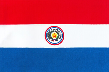 the national flag of Paraguay on a fabric basis close-up