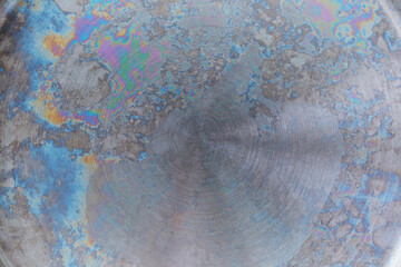 abstract metallic background, rainbow color on metal, interference of light waves in an oxide film