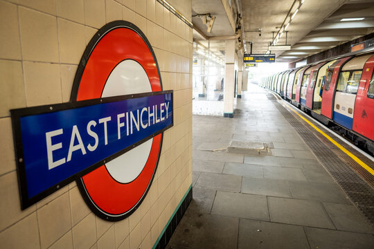 London- East Finchley Underground logo on platform, Northern Line tube station