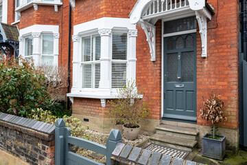 UK- A typical red brick suburban house front door and bay window in South London - obrazy, fototapety, plakaty