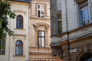 Exterior view of historical old town buildings in the downtown of Budapest, Hungary, Europe. Colorful houses in the V. district, the true inner city of Pest. Heritage houses in an urban neighborhood.