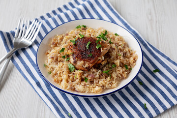 Homemade Paprika Chicken and Rice on a Plate, side view.